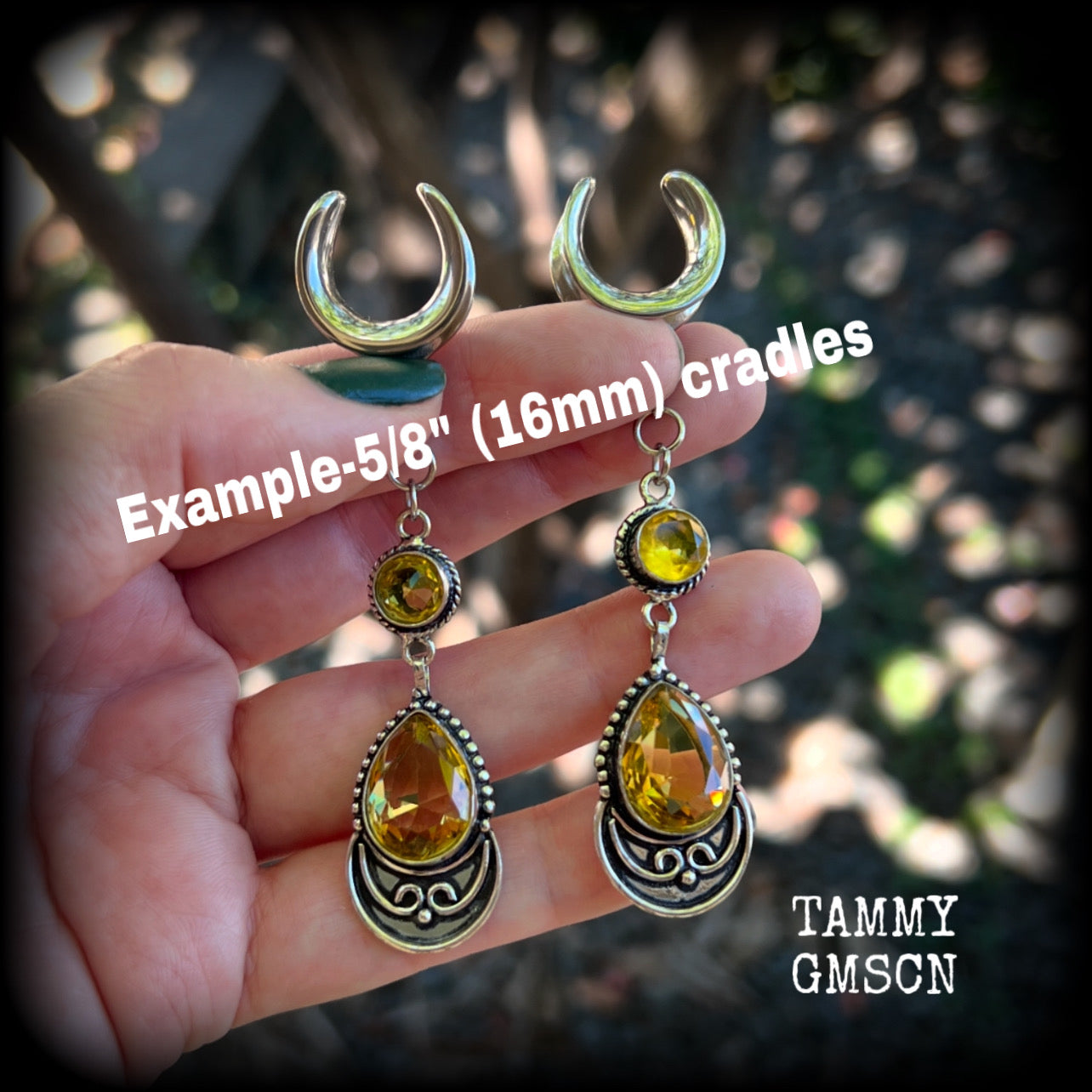 Featuring gorgeous golden yellow cutrine gemstone in a beautiful boho antique silver setting, these earrings measure just over 8cms from tip to tip, and weigh approx 11 grams each.

This pair have been made on 5/8” gauge (16mm) surgical steel full curl hooks, suitable for stretched lobes.
