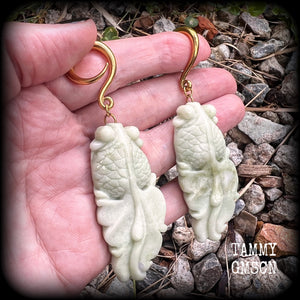 These gorgeous earrings feature carved jade koi fish, weighing approx. 20 grams each and measuring approx 9cms from tip to tip.
This pair have been made on 6 gauge (4mm) surgical steel full curls, suitable for stretched lobes.
