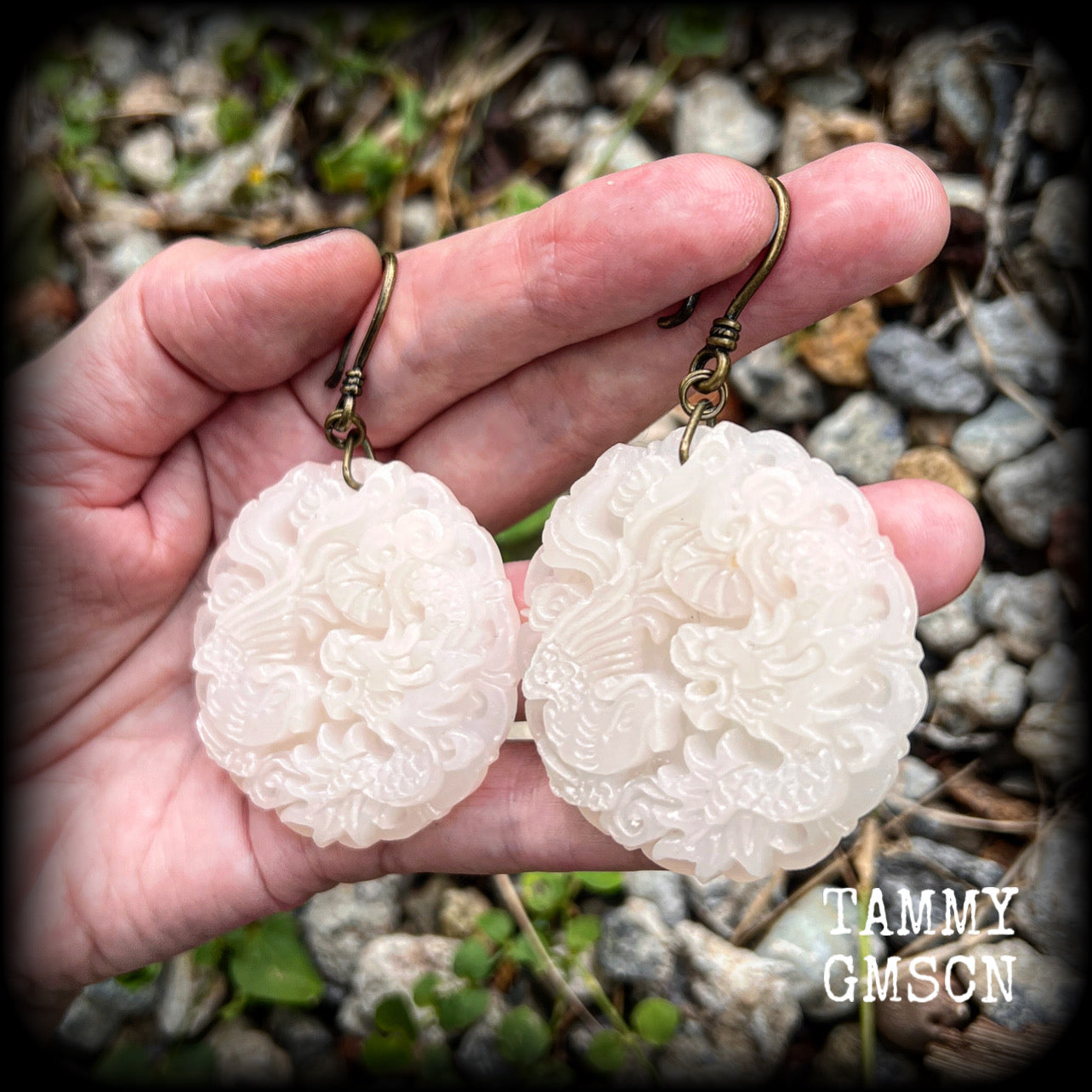 These jade earrings feature a dragon and phoenix, measuring 8 cms from tip to tip, and weighing 35 grams each.
This pair have been made on small antique bronze shephard hooks, to be worn with silicone earlets in stretched ears from 8 gauge (3mm).