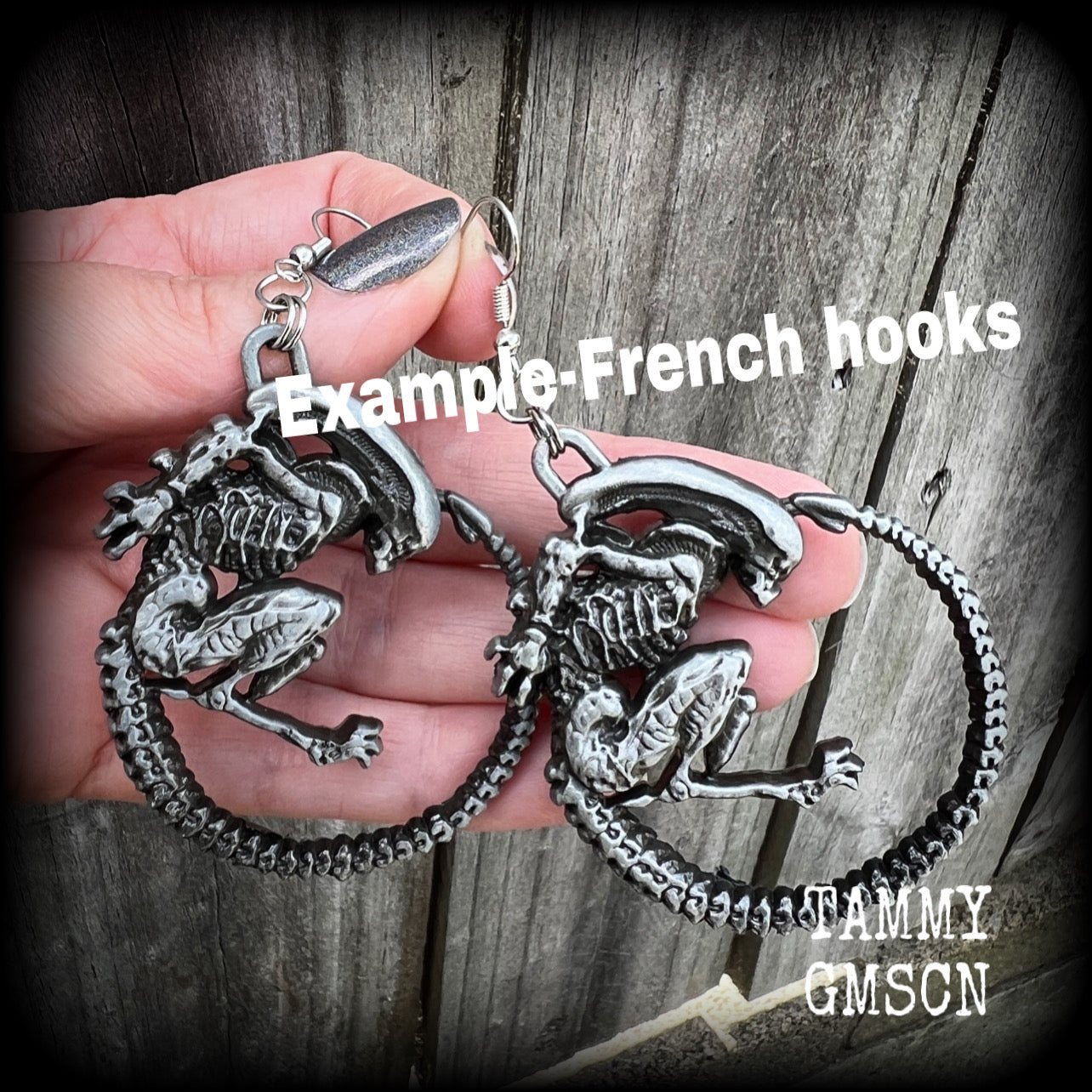 These awesome earrings feature a pair of large pewter Alien Queen Xenomorphs, measuring 9cms from tip to tip (nice and big), and weigh 38 grams each (these are HEAVY).

This pair have been made on small antique silver shephard hooks to be worn in stretched lobes with silicone earlets from 8 gauge (3mm).