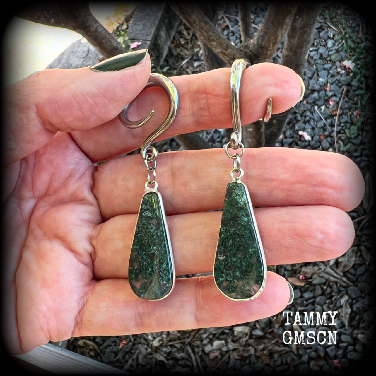 🔥 Moss agate is known to attract prosperity, balance emotions, and boost physical health and fertility 🔥

These unique gauged earrings feature gorgeous green moss agate teardrop gemstones, measure just over 6cms from tip to tip, and weigh approx 6 grams each.

This pair have been made with 6 gauge (4mm) surgical steel full curls, suitable for stretched lobes.