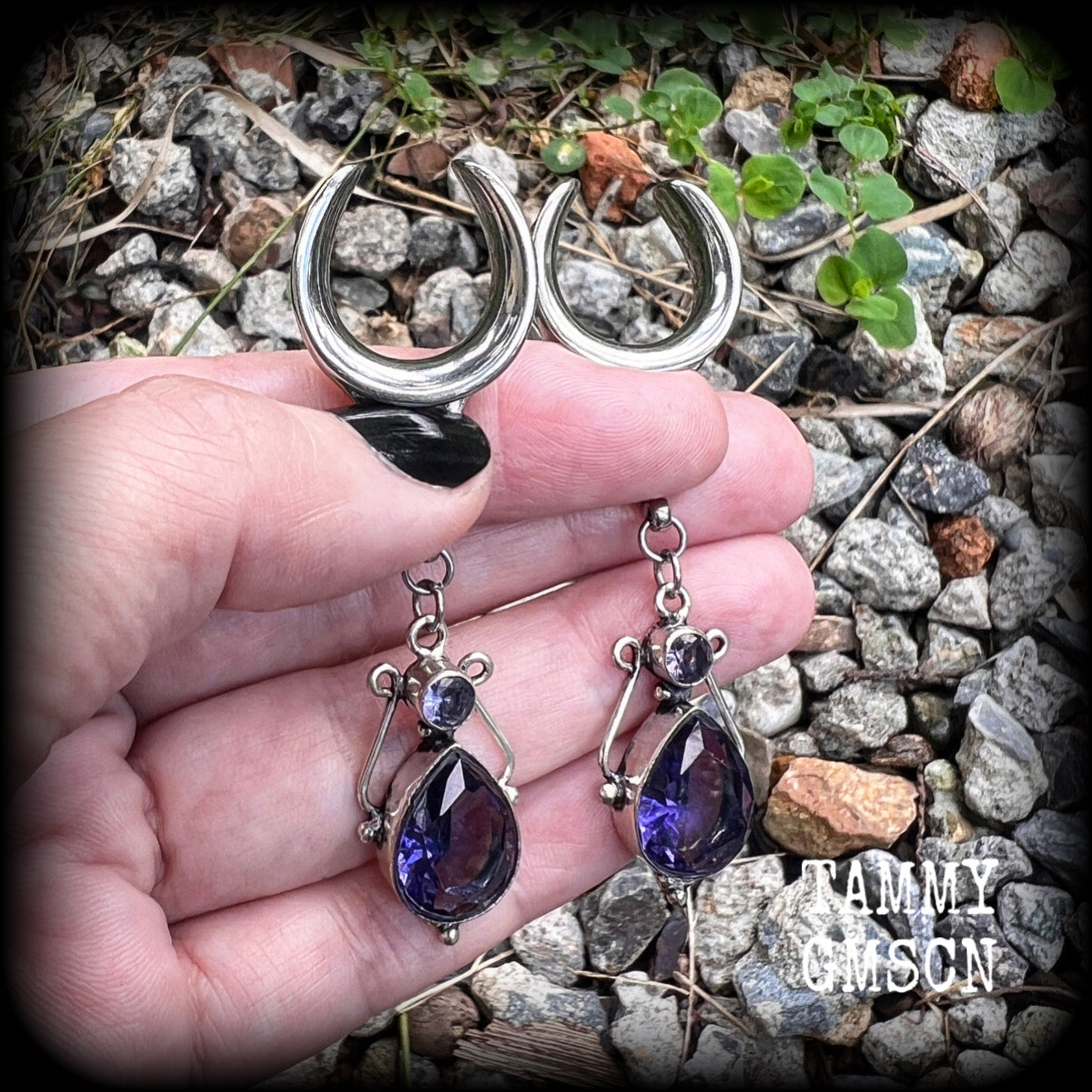 These earrings feature amethyst gemstones in an antique silver boho setting, measuring just over 7cms from tip to tip, and weighing approx 9 grams each, not too heavy...
Made on 3/4” gauge (19mm) surgical steel cradles-suitable for stretched lobes.