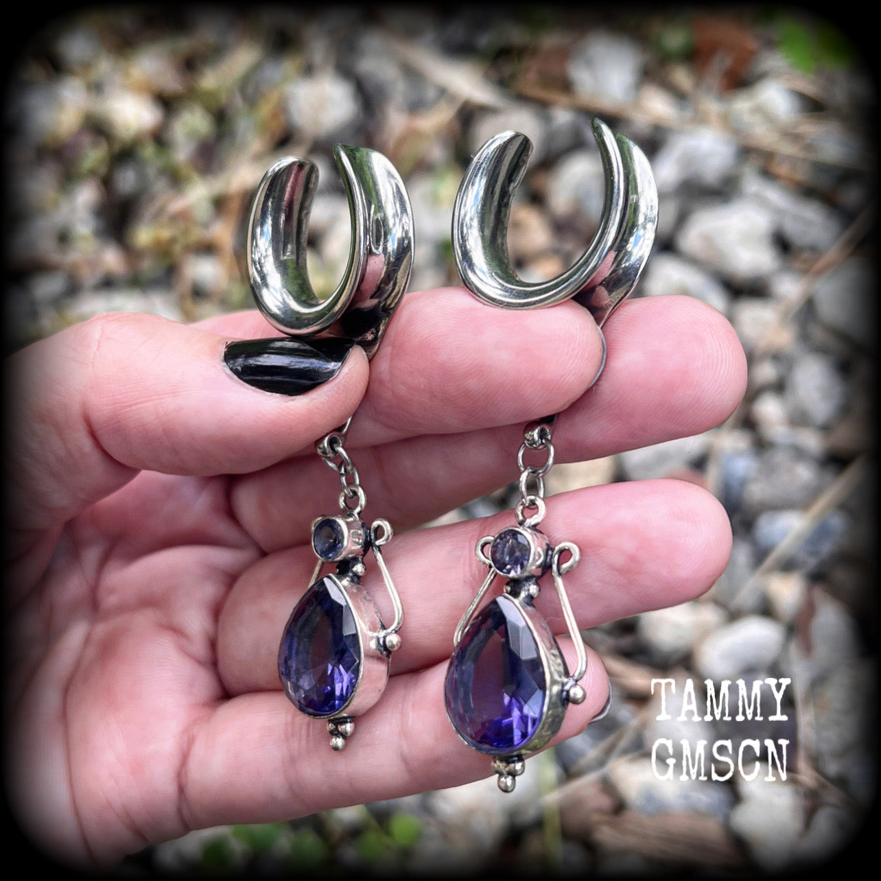 These earrings feature amethyst gemstones in an antique silver boho setting, measuring just over 7cms from tip to tip, and weighing approx 9 grams each, not too heavy...
Made on 3/4” gauge (19mm) surgical steel cradles-suitable for stretched lobes.