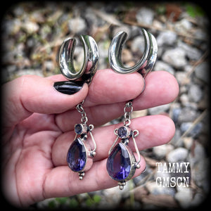 These earrings feature amethyst gemstones in an antique silver boho setting, measuring just over 7cms from tip to tip, and weighing approx 9 grams each, not too heavy...
Made on 3/4” gauge (19mm) surgical steel cradles-suitable for stretched lobes.