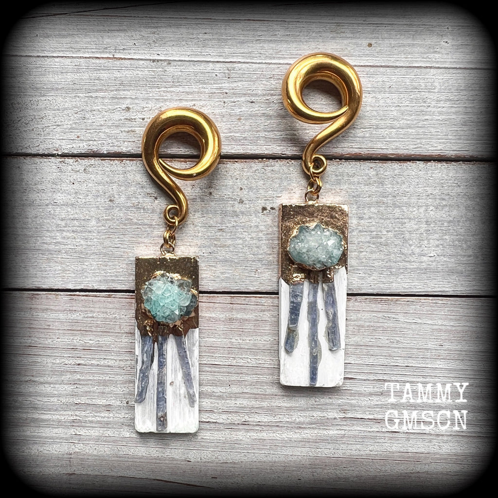 These unique gauged earrings feature selenite with ocean green druzy and sky blue kyanite, measuring approx 10cms from tip to tip, and weighing approx 25 grams each.

This pair have been made on 0 gauge (8mm) surgical steel full curl hooks, to be worn in stretched lobes.