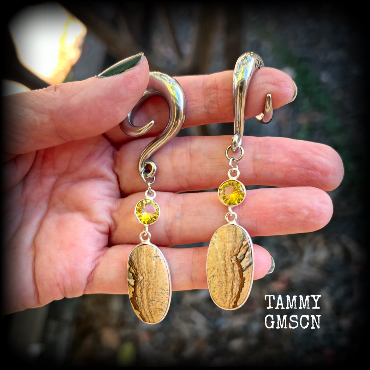🔥 Picture jasper is used to connect to the Earth's energy, promote emotional balance, and inspire visualization in meditation.

Featuring beautiful picture jasper gems hanging from golden yellow citrine gemstones, these earrings measure just over 8cms from tip to tip, and weigh approx 17 grams each.

This pair have been made on 0 gauge (8mm) surgical steel full curl hooks, suitable for stretched lobes.
