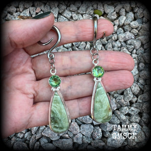 These beautiful Serpentine and green garnet earrings are made with gorgeous polished and faceted gemstones, lovely and dangly measuring just approx 7.5cms from tip to tip, and weighing approx 9 grams each.   These earrings have been made on 6 gauge (4mm) surgical steel full curl hooks, to be worn in stretched lobes.