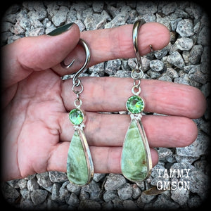 These beautiful Serpentine and green garnet earrings are made with gorgeous polished and faceted gemstones, lovely and dangly measuring just approx 7.5cms from tip to tip, and weighing approx 9 grams each.   These earrings have been made on 6 gauge (4mm) surgical steel full curl hooks, to be worn in stretched lobes.