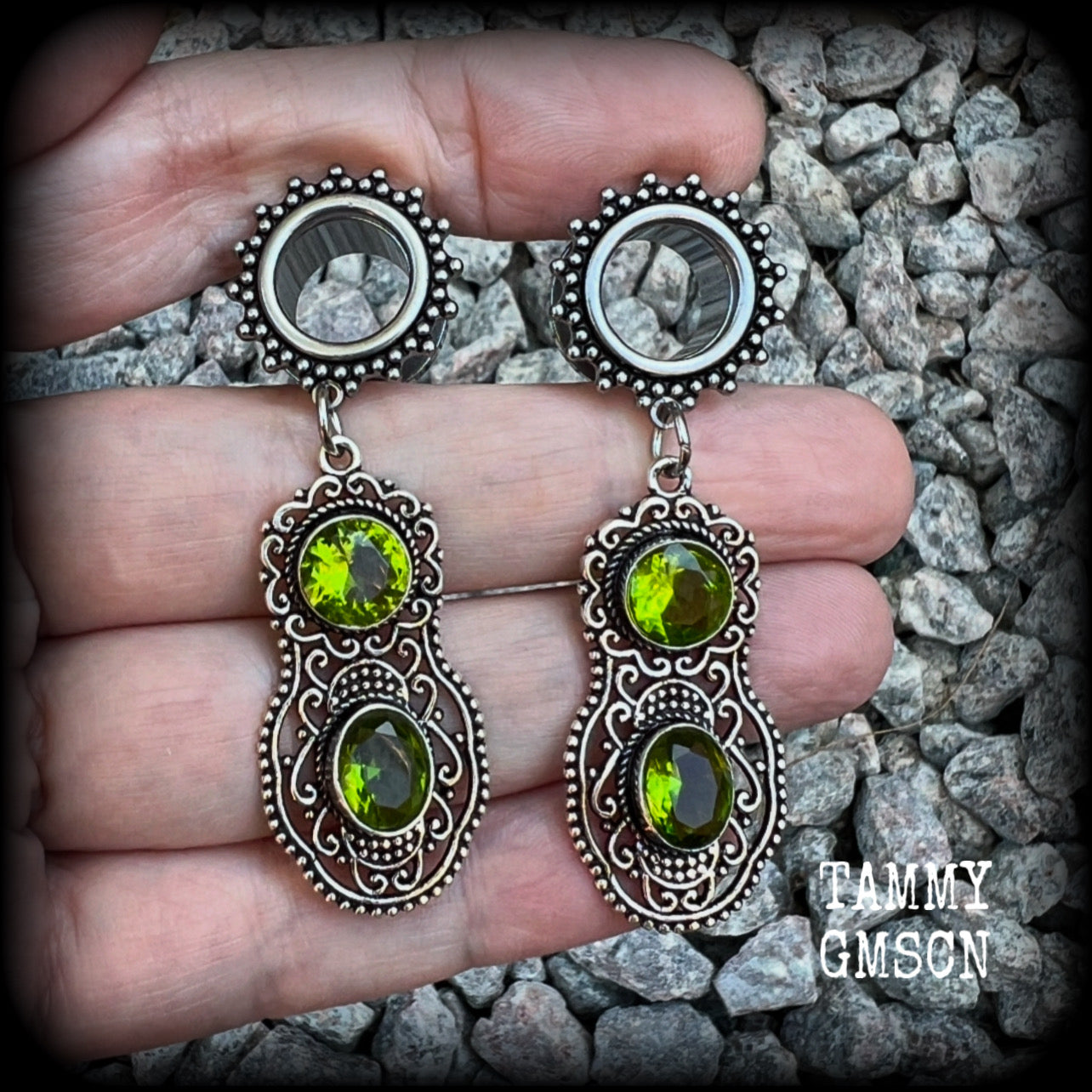 These beautiful boho tunnel earrings feature gorgeous green peridot gemstones in a gypsy boho style antique silver setting, weighing approx 9 grams each and measuring just under 6cms from tip to tip.  This pair have been made with 1/2” (12mm) gauge ornate surgical steel screw fit tunnels.