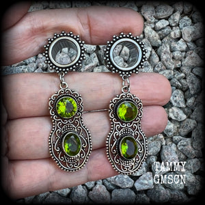 These beautiful boho tunnel earrings feature gorgeous green peridot gemstones in a gypsy boho style antique silver setting, weighing approx 9 grams each and measuring just under 6cms from tip to tip.  This pair have been made with 1/2” (12mm) gauge ornate surgical steel screw fit tunnels.