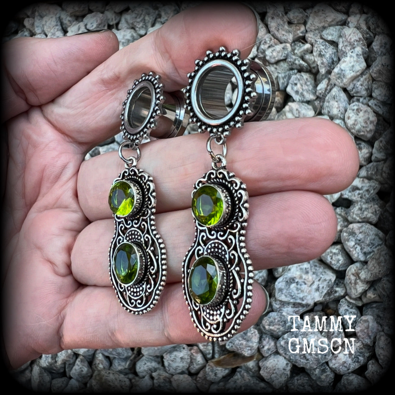 These beautiful boho tunnel earrings feature gorgeous green peridot gemstones in a gypsy boho style antique silver setting, weighing approx 9 grams each and measuring just under 6cms from tip to tip.  This pair have been made with 1/2” (12mm) gauge ornate surgical steel screw fit tunnels.