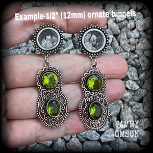 These beautiful boho tunnel earrings feature gorgeous green peridot gemstones in a gypsy boho style antique silver setting, weighing approx 9 grams each and measuring just under 6cms from tip to tip.  This pair have been made with 1/2” (12mm) gauge ornate surgical steel screw fit tunnels.