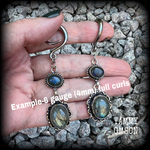 These gorgeous gemstone earrings feature beautiful polished labradorite gemstones in a gorgeous boho antique silver setting. Lovely and dangly, these earrings measure 7.5cms from tip to tip, and weigh approx 10 grams each.  This pair have been made with 6 gauge (4mm) surgical steel full curl hooks, suitable for stretched lobes.
