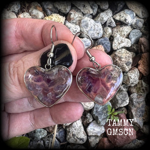 These beautiful gemstone earrings feature gorgeous amethyst gemstone chips set in a resin heart, are nice and lightweight at only 3 grams each and measure just on 4cms from tip to tip.

This pair have been made with stainless steel french hooks, for pierced ears.