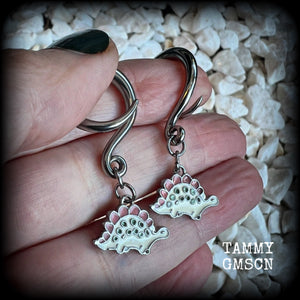 These adorable pink and white enamel stegosaurus gauged earrings are nice and light weight at approx 5 grams a piece, and nice and dangly at just under 5cms from tip to tip.

This pair has been made on 6 gauge (4mm) surgical steel full curl hooks, to be worn in stretched lobes.