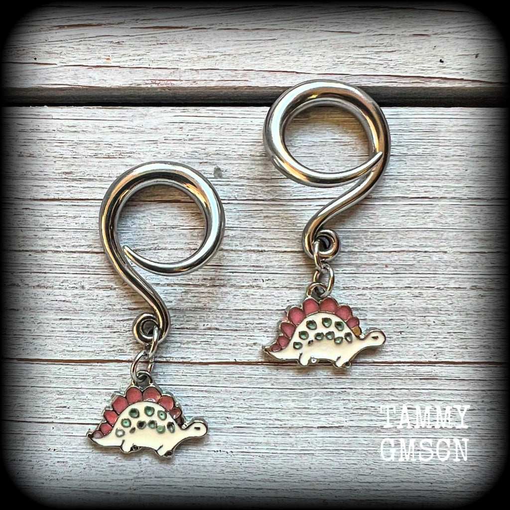 These adorable pink and white enamel stegosaurus gauged earrings are nice and light weight at approx 5 grams a piece, and nice and dangly at just under 5cms from tip to tip.

This pair has been made on 6 gauge (4mm) surgical steel full curl hooks, to be worn in stretched lobes.