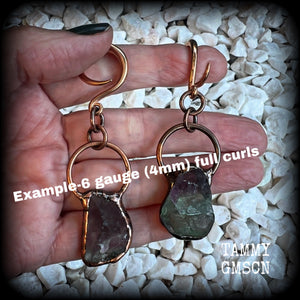 Featuring gorgeous unique fluorite gemstones in an antique copper setting, these gauged earrings measure approx 7.5cms from tip to tip, and weigh approx 15 grams each.

This pair has been made on 6 gauge (4mm) rose gold tone surgical steel full curl hooks, suitable for stretched lobes.