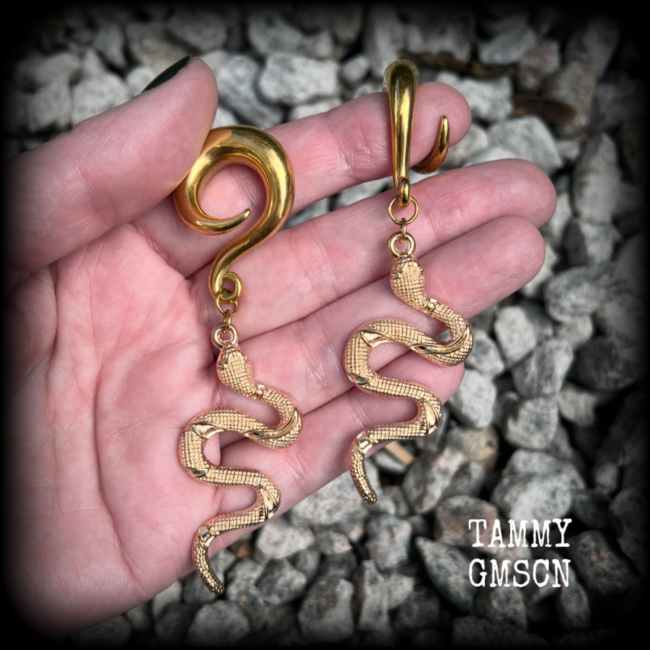 These awesome antique gold snake gauged earrings are super witchy, weighing in at 18 grams a piece, and are nice and dangly, hanging just on 9cms from tip to tip.

These earrings have been made on 0 gauge (8mm) surgical steel full curl hooks, to be worn in stretched lobes.