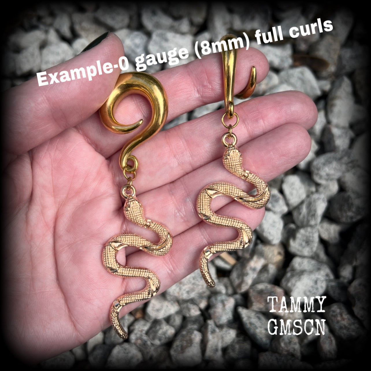 These awesome antique gold snake gauged earrings are super witchy, weighing in at 18 grams a piece, and are nice and dangly, hanging just on 9cms from tip to tip.

These earrings have been made on 0 gauge (8mm) surgical steel full curl hooks, to be worn in stretched lobes.