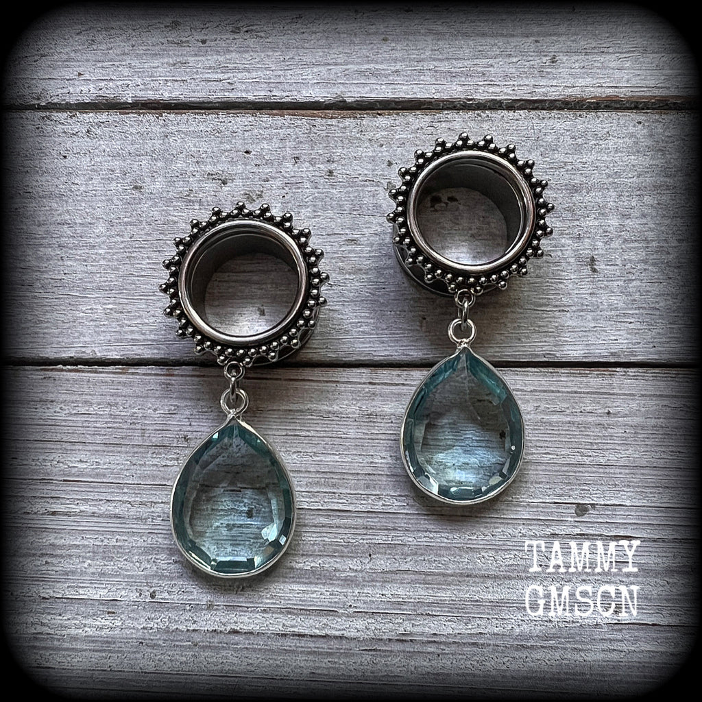These gorgeous tunnel dangles feature beautiful blue topaz gemstones set in antique silver, weighing approx 16 grams each and measuring just over 5cms from tip to tip.
This pair has been made with 5/8" gauge (16mm) surgical steel ornate tunnels-for stretched lobes.