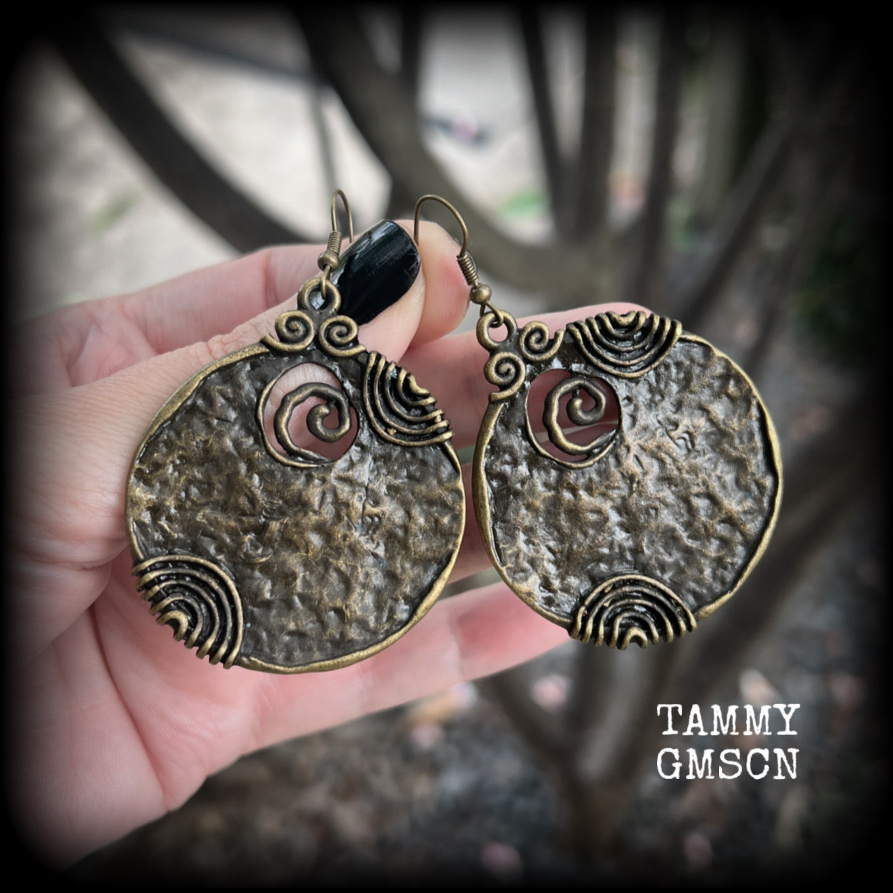 These gorgeous earrings feature large ornate antique bronze discs, measuring 8cm from tip to tip, and weighing 14grams a piece.

This pair has been made with antique bronze french hooks, for pierced ears.
