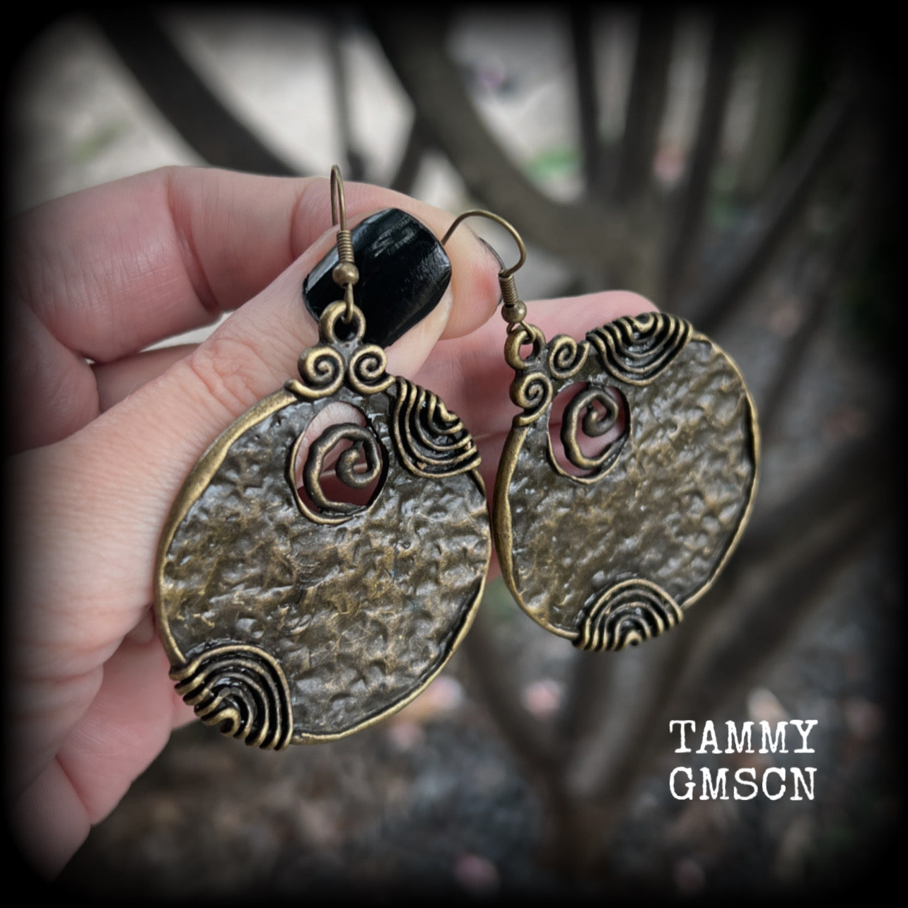 These gorgeous earrings feature large ornate antique bronze discs, measuring 8cm from tip to tip, and weighing 14grams a piece.

This pair has been made with antique bronze french hooks, for pierced ears.
