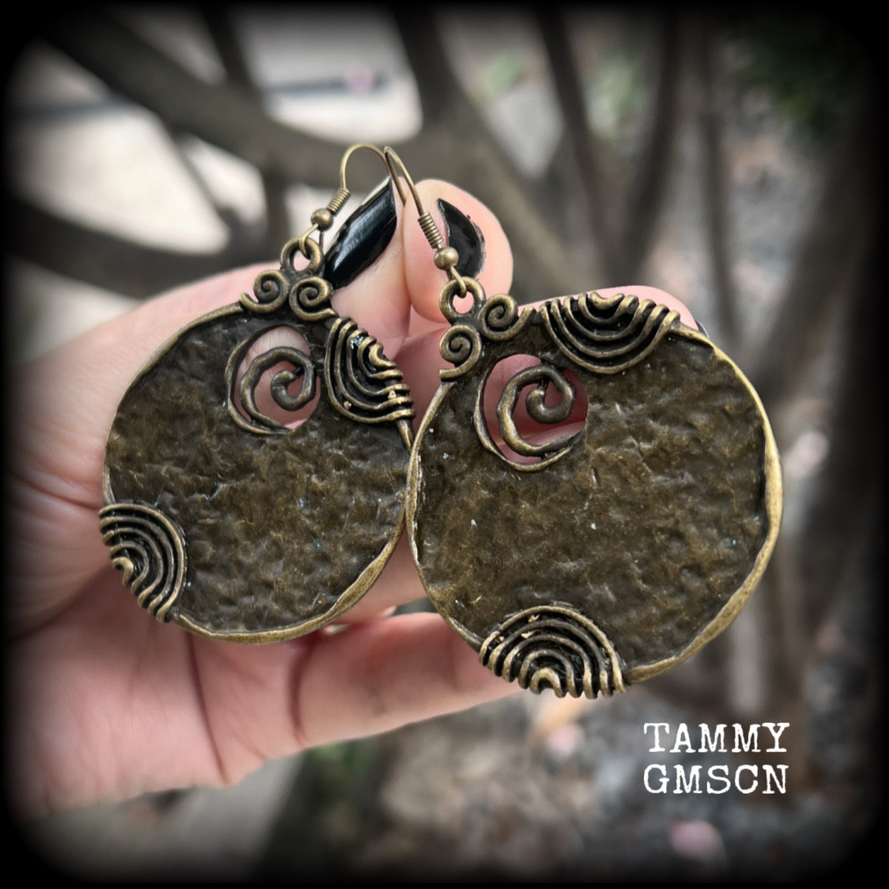 These gorgeous earrings feature large ornate antique bronze discs, measuring 8cm from tip to tip, and weighing 14grams a piece.

This pair has been made with antique bronze french hooks, for pierced ears.
