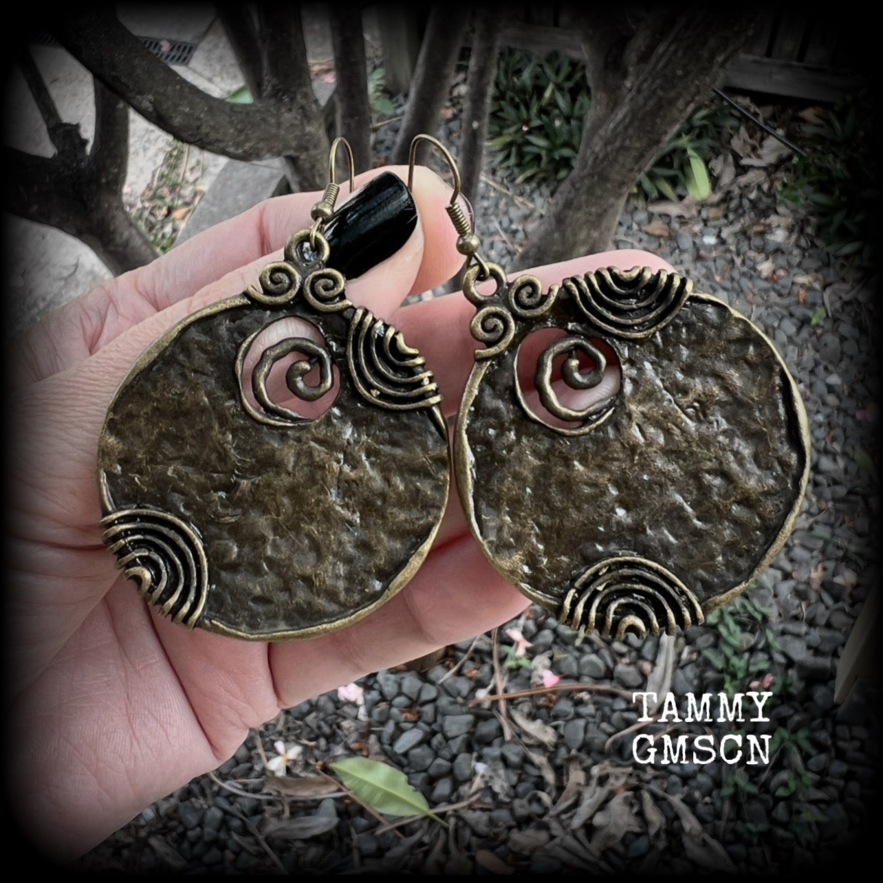 These gorgeous earrings feature large ornate antique bronze discs, measuring 8cm from tip to tip, and weighing 14grams a piece.

This pair has been made with antique bronze french hooks, for pierced ears.
