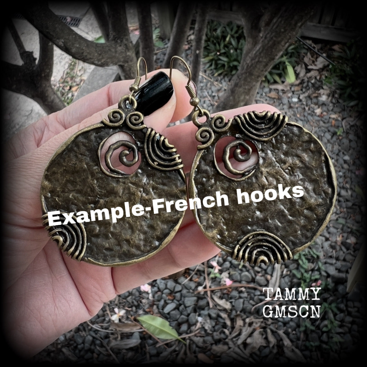 These gorgeous earrings feature large ornate antique bronze discs, measuring 8cm from tip to tip, and weighing 14grams a piece.

This pair has been made with antique bronze french hooks, for pierced ears.
