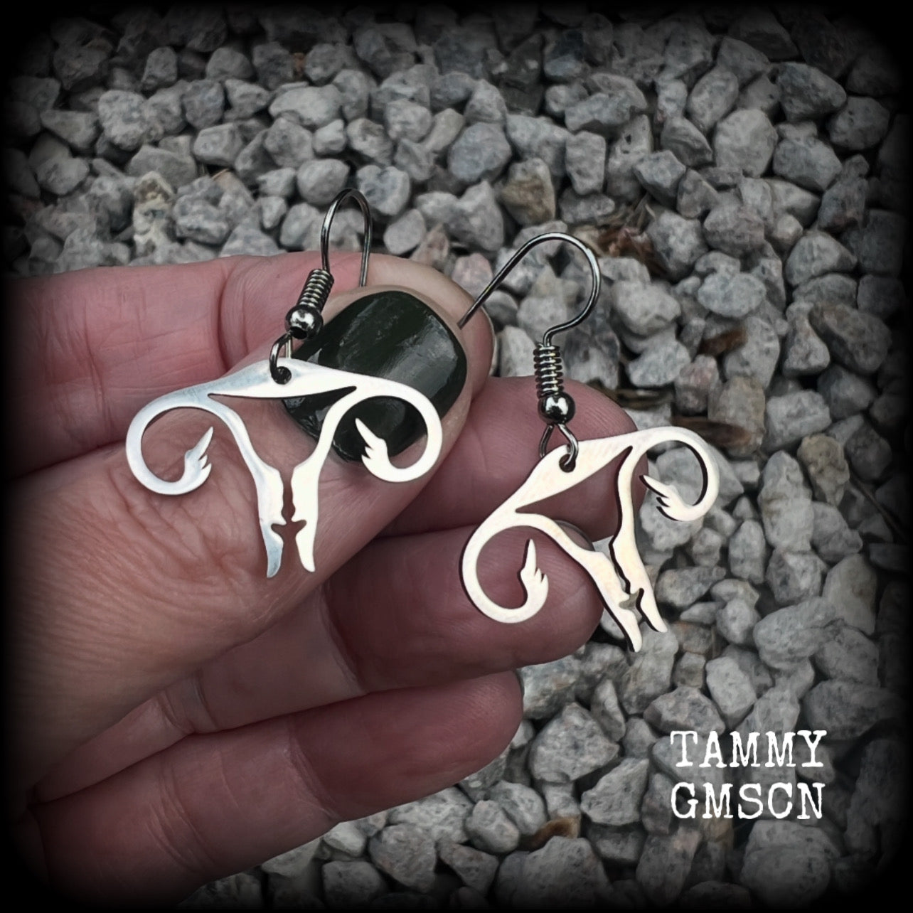 These amazing earrings feature offensive stainless steel female reproductive organs giving the middle finger! Nice and lightweight, weighing only a few grams each, these earrings measure approx 3.5cms from tip to tip.

This pair have been made on stainless steel french hooks, for pierced ears.
