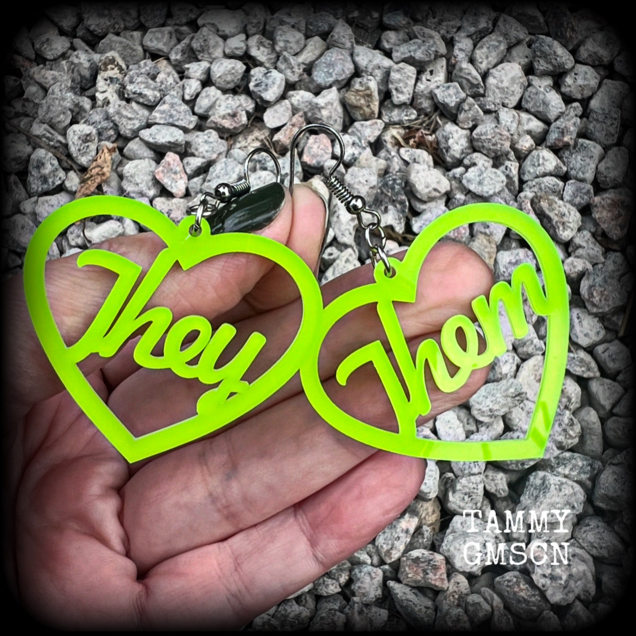 These earrings feature gorgeous bright neon green hearts showing the pronouns THEY/THEM. 
These are nice and lightweight (at only a few grams each), and measure approx 6.5cms from tip to tip.

This pair have been made on stainless steel french hooks, for pierced ears.