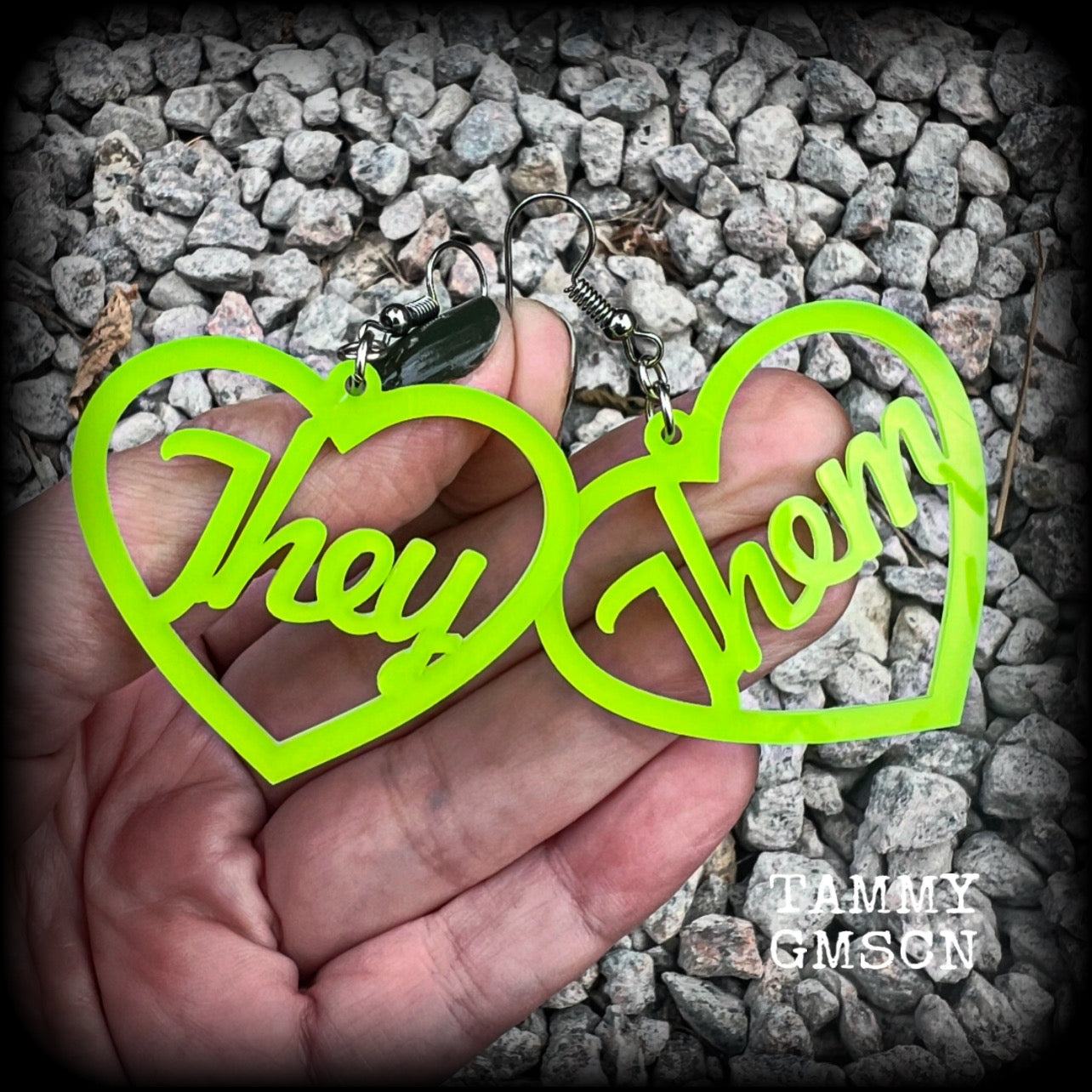 These earrings feature gorgeous bright neon green hearts showing the pronouns THEY/THEM. 
These are nice and lightweight (at only a few grams each), and measure approx 6.5cms from tip to tip.

This pair have been made on stainless steel french hooks, for pierced ears.
