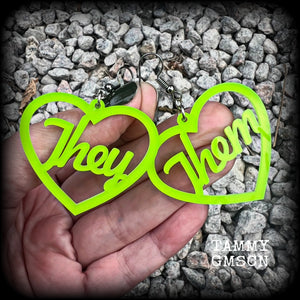 These earrings feature gorgeous bright neon green hearts showing the pronouns THEY/THEM. 
These are nice and lightweight (at only a few grams each), and measure approx 6.5cms from tip to tip.

This pair have been made on stainless steel french hooks, for pierced ears.
