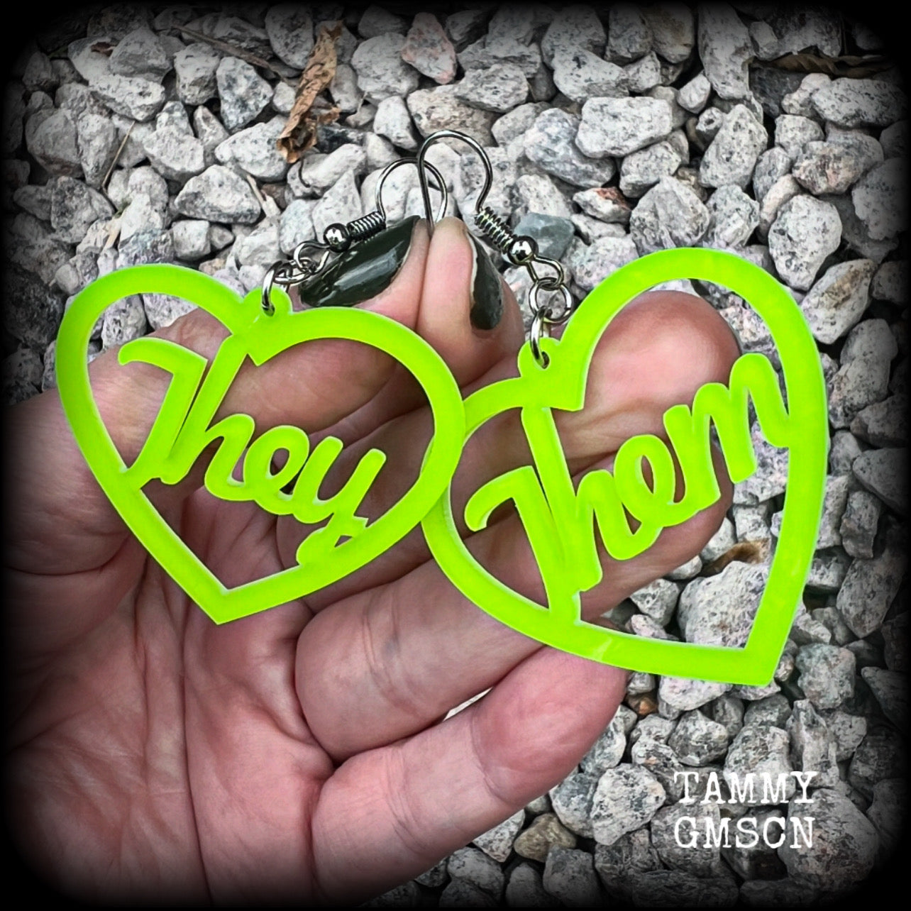 These earrings feature gorgeous bright neon green hearts showing the pronouns THEY/THEM. 
These are nice and lightweight (at only a few grams each), and measure approx 6.5cms from tip to tip.

This pair have been made on stainless steel french hooks, for pierced ears.