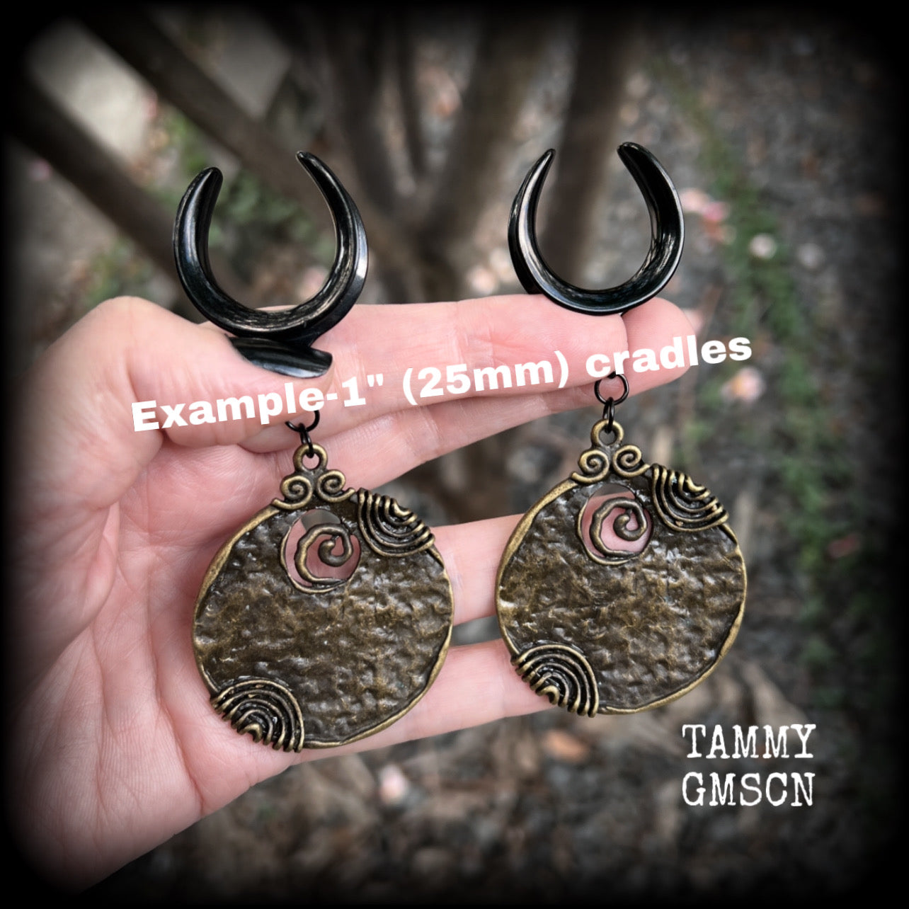 This pair of gauged earrings features big beautiful antique bronze tribal discs, lovely and dangly measuring just under 10cms from tip to tip and weighing in at 22 grams a piece.

This pair has been made on 3/4” gauge (19mm) surgical steel cradles, suitable for stretched lobes.