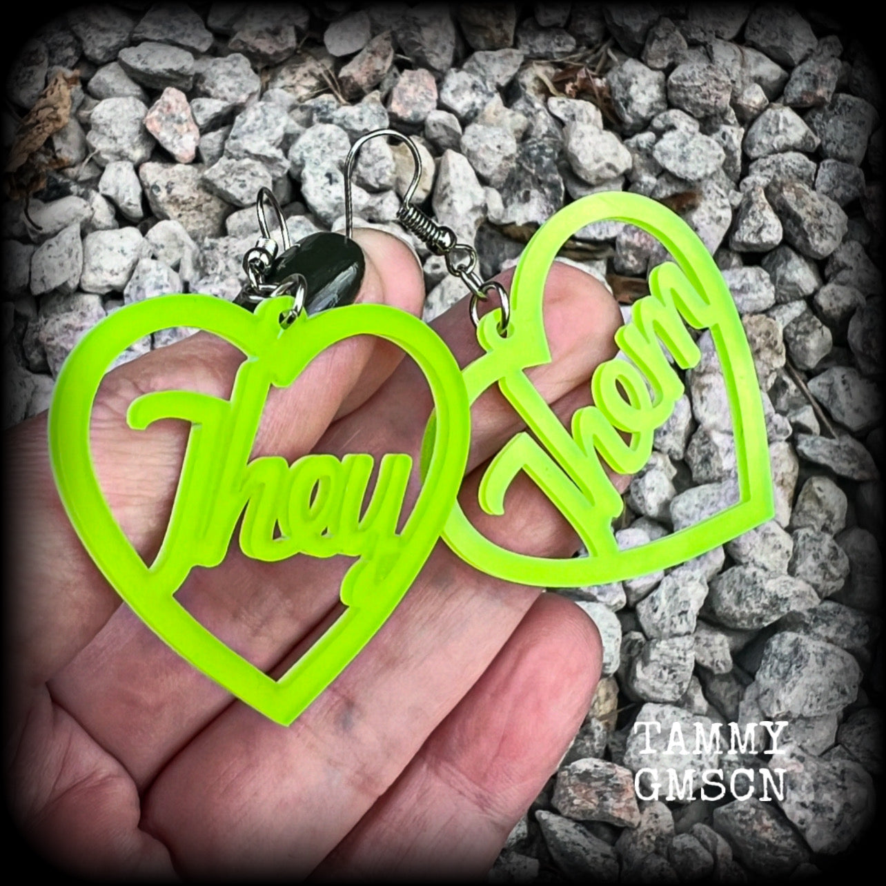 These earrings feature gorgeous bright neon green hearts showing the pronouns THEY/THEM. 
These are nice and lightweight (at only a few grams each), and measure approx 6.5cms from tip to tip.

This pair have been made on stainless steel french hooks, for pierced ears.