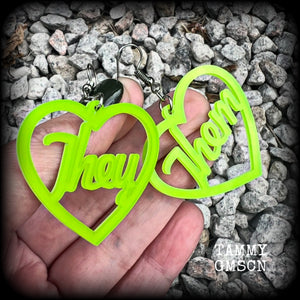 These earrings feature gorgeous bright neon green hearts showing the pronouns THEY/THEM. 
These are nice and lightweight (at only a few grams each), and measure approx 6.5cms from tip to tip.

This pair have been made on stainless steel french hooks, for pierced ears.