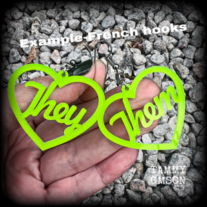 These earrings feature gorgeous bright neon green hearts showing the pronouns THEY/THEM. 
These are nice and lightweight (at only a few grams each), and measure approx 6.5cms from tip to tip.

This pair have been made on stainless steel french hooks, for pierced ears.