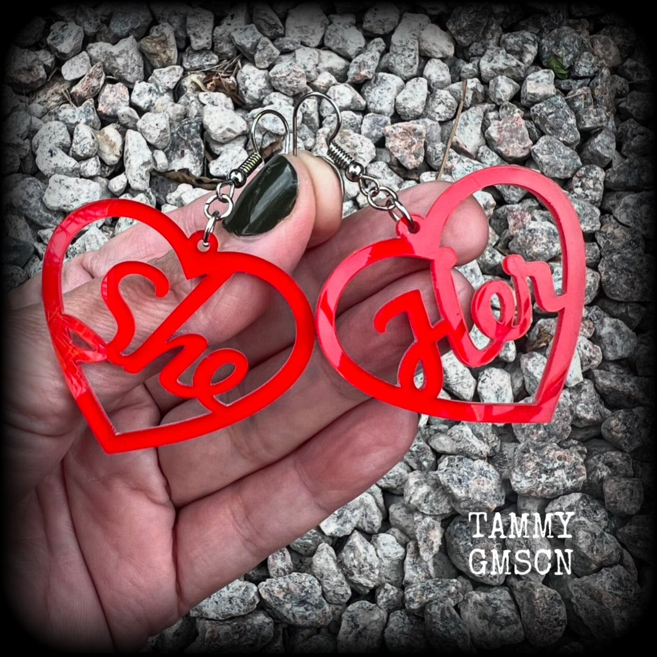 These earrings feature gorgeous bright red hearts showing the pronouns SHE/HER. 
These are nice and lightweight (at only a few grams each), and measure approx 6.5cms from tip to tip.

This pair have been made on stainless steel french hooks, for pierced ears.