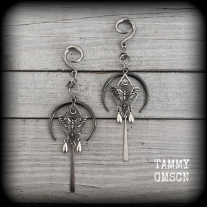 These gorgeous antique silver 'Moth and moon" gauged earrings feature an antique silver moth pendant sitting atop a black inverted crescent moon charm, dripping with antique silver teardrops.
Measuring just under 11cms, weighing approx 11 grams each.