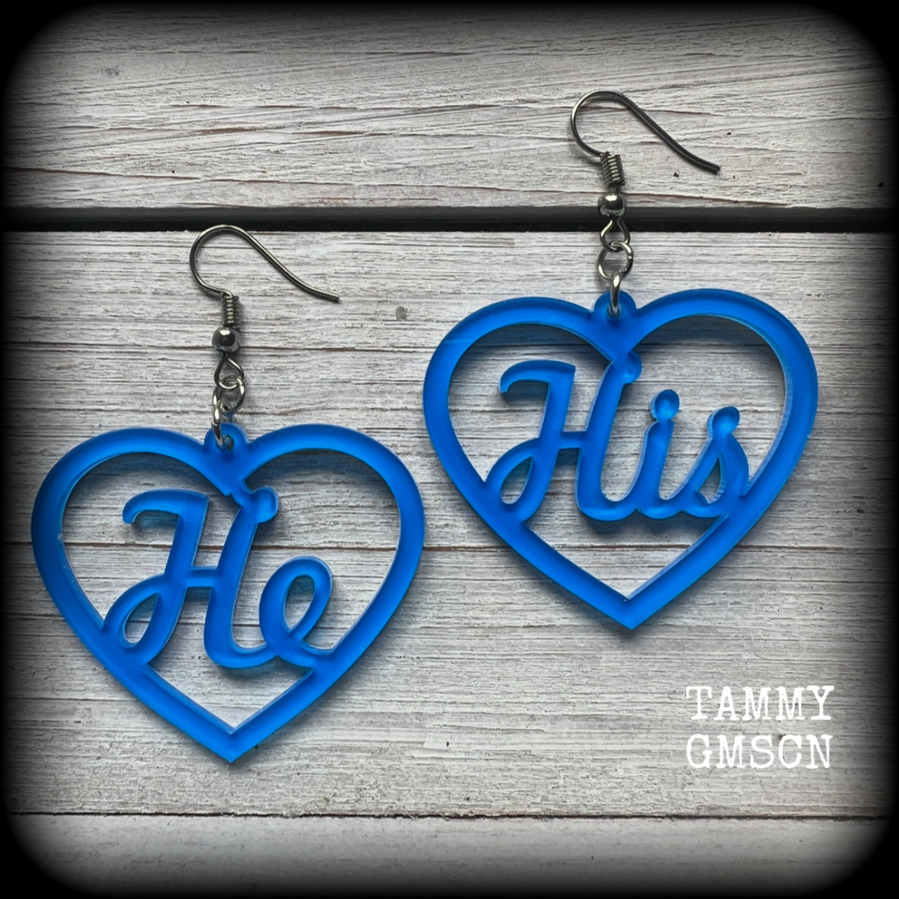 These awesome earrings feature gorgeous bright neon blue hearts showing the pronouns HE/HIS. 
These are nice and lightweight (at only a few grams each), and measure approx 6.5cms from tip to tip.

This pair have been made on stainless steel french hooks, for pierced ears.