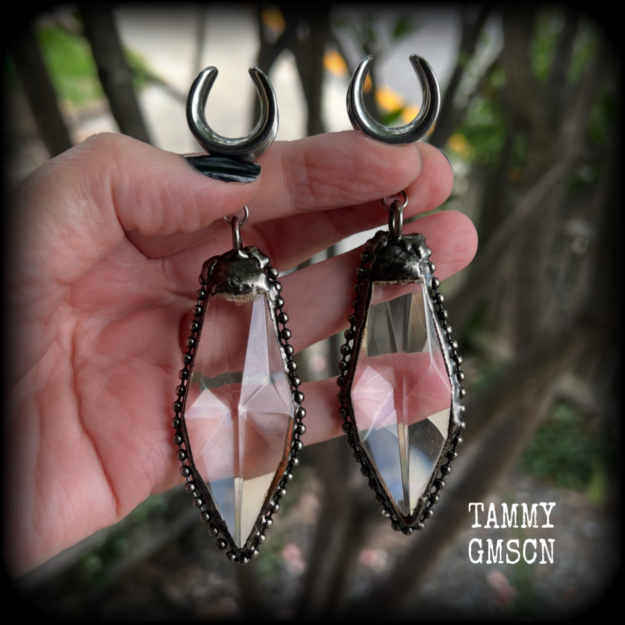 These gorgeous dangly glass earrings have been made with gorgeous chunky faceted clear glass pieced, measuring 10.5 cms from tip to tip, and weighing approx 26 grams each.

These earrings have been made on 5/8" gauge (16mm) surgical steel cradles, to be worn in stretched lobes.