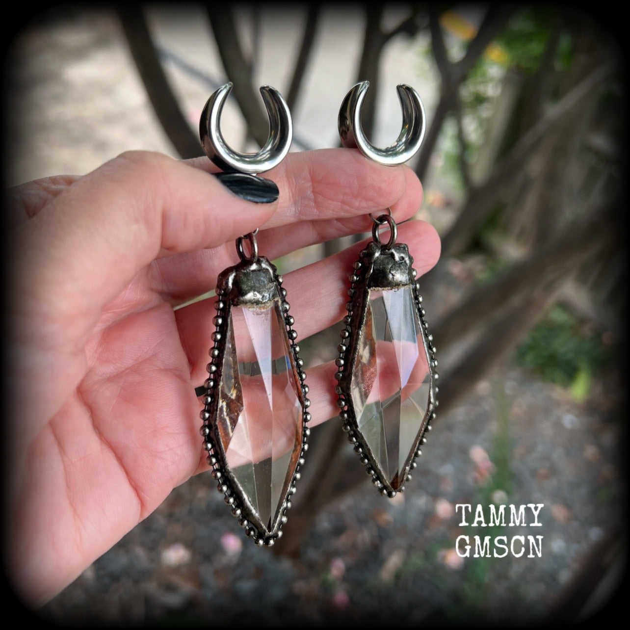 These gorgeous dangly glass earrings have been made with gorgeous chunky faceted clear glass pieced, measuring 10.5 cms from tip to tip, and weighing approx 26 grams each.

These earrings have been made on 5/8" gauge (16mm) surgical steel cradles, to be worn in stretched lobes.
