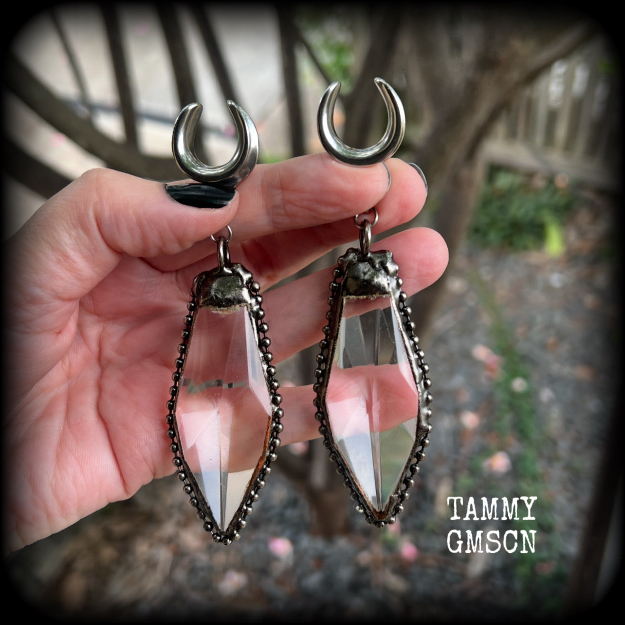 These gorgeous dangly glass earrings have been made with gorgeous chunky faceted clear glass pieced, measuring 10.5 cms from tip to tip, and weighing approx 26 grams each.

These earrings have been made on 5/8" gauge (16mm) surgical steel cradles, to be worn in stretched lobes.