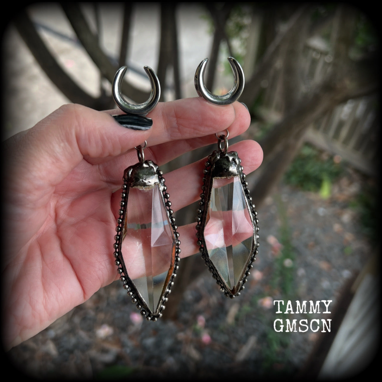 These gorgeous dangly glass earrings have been made with gorgeous chunky faceted clear glass pieced, measuring 10.5 cms from tip to tip, and weighing approx 26 grams each.

These earrings have been made on 5/8" gauge (16mm) surgical steel cradles, to be worn in stretched lobes.