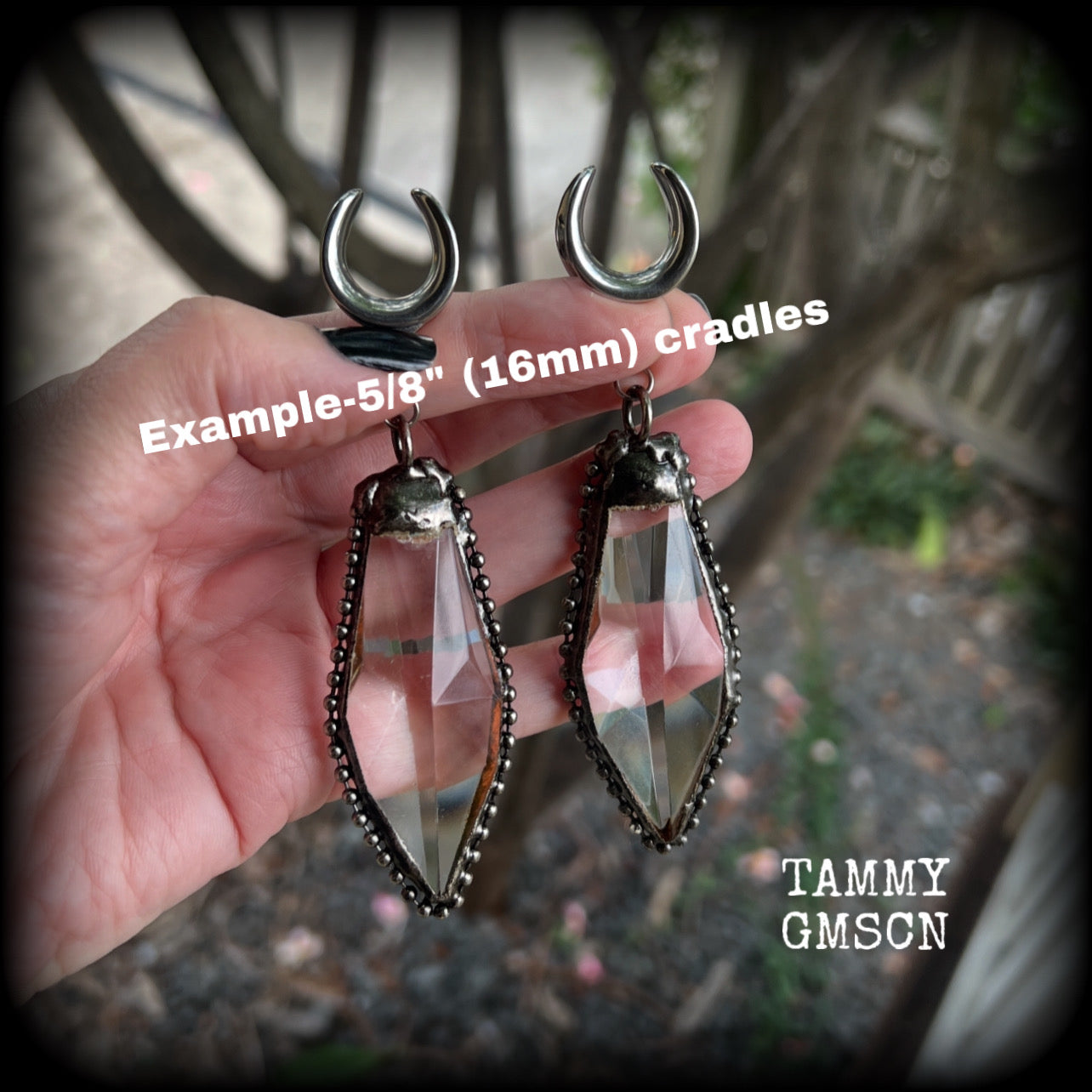 These gorgeous dangly glass earrings have been made with gorgeous chunky faceted clear glass pieced, measuring 10.5 cms from tip to tip, and weighing approx 26 grams each.

These earrings have been made on 5/8" gauge (16mm) surgical steel cradles, to be worn in stretched lobes.