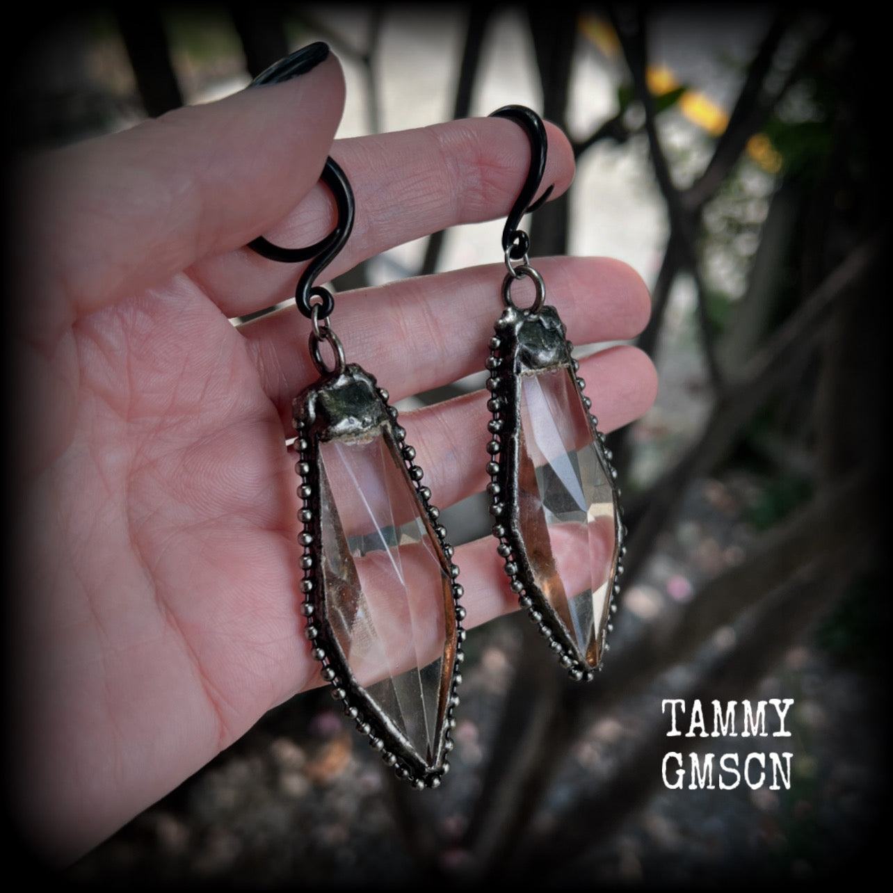 These gorgeous dangly gothic glass earrings have been made with gorgeous chunky faceted clear glass pieces, measuring just on 10 cms from tip to tip, and weighing approx 24 grams each.

These earrings have been made on 6 gauge (4mm) surgical steel full curls, to be worn in stretched lobes.