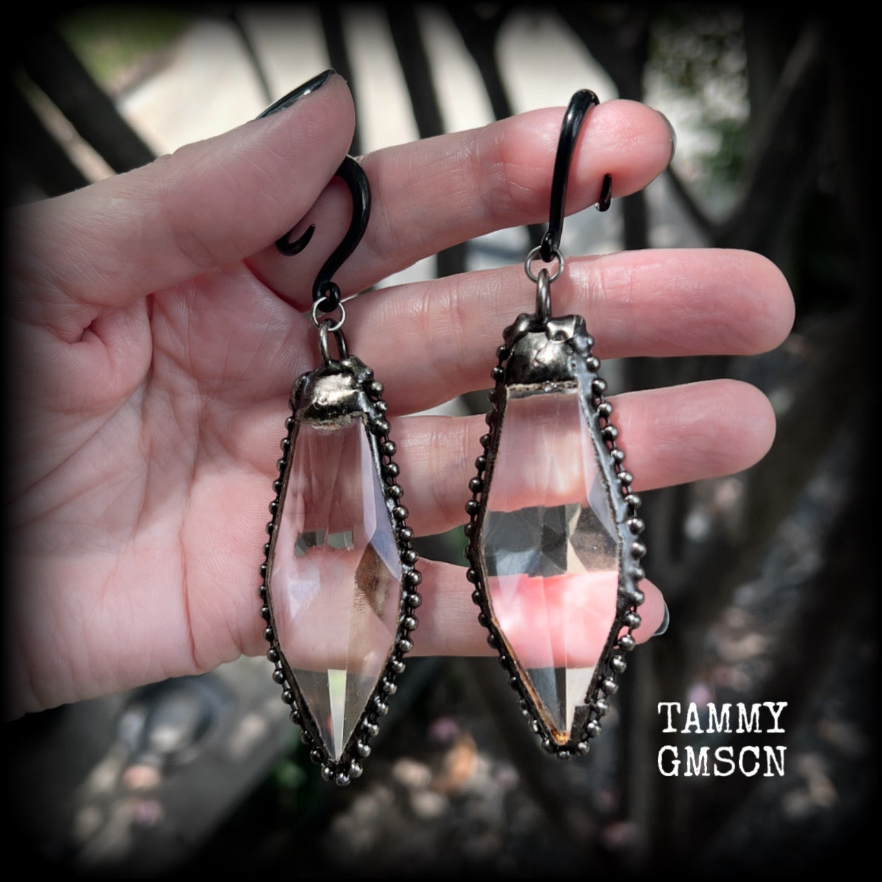 These gorgeous dangly gothic glass earrings have been made with gorgeous chunky faceted clear glass pieces, measuring just on 10 cms from tip to tip, and weighing approx 24 grams each.

These earrings have been made on 6 gauge (4mm) surgical steel full curls, to be worn in stretched lobes.