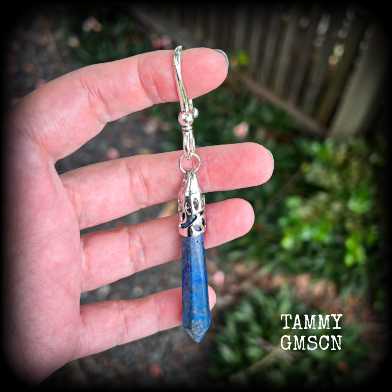 This listing is for a SINGLE Lapis lazuli earring, measuring just under 11cms from tip to tip and weighing in at 16 grams a piece.

This earring has been made with a large antique silver shephards hook to be worn through silicone earlets from 2 gauge (6mm).