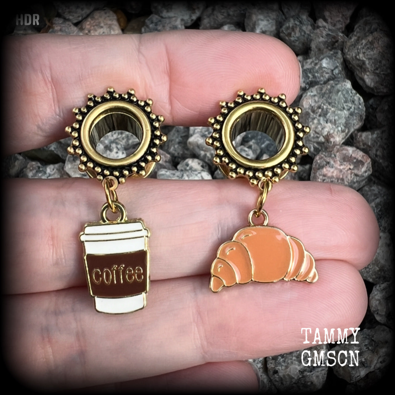 These adorable tunnel earrings feature a cup of coffee and a cute croissant, weighing approx 5 grams each, and measuring just under 4cms from tip to tip.

This pair has been made with 00 gauge (10mm) surgical steel ornate screw fit tunnels-suitable for pierced ears.